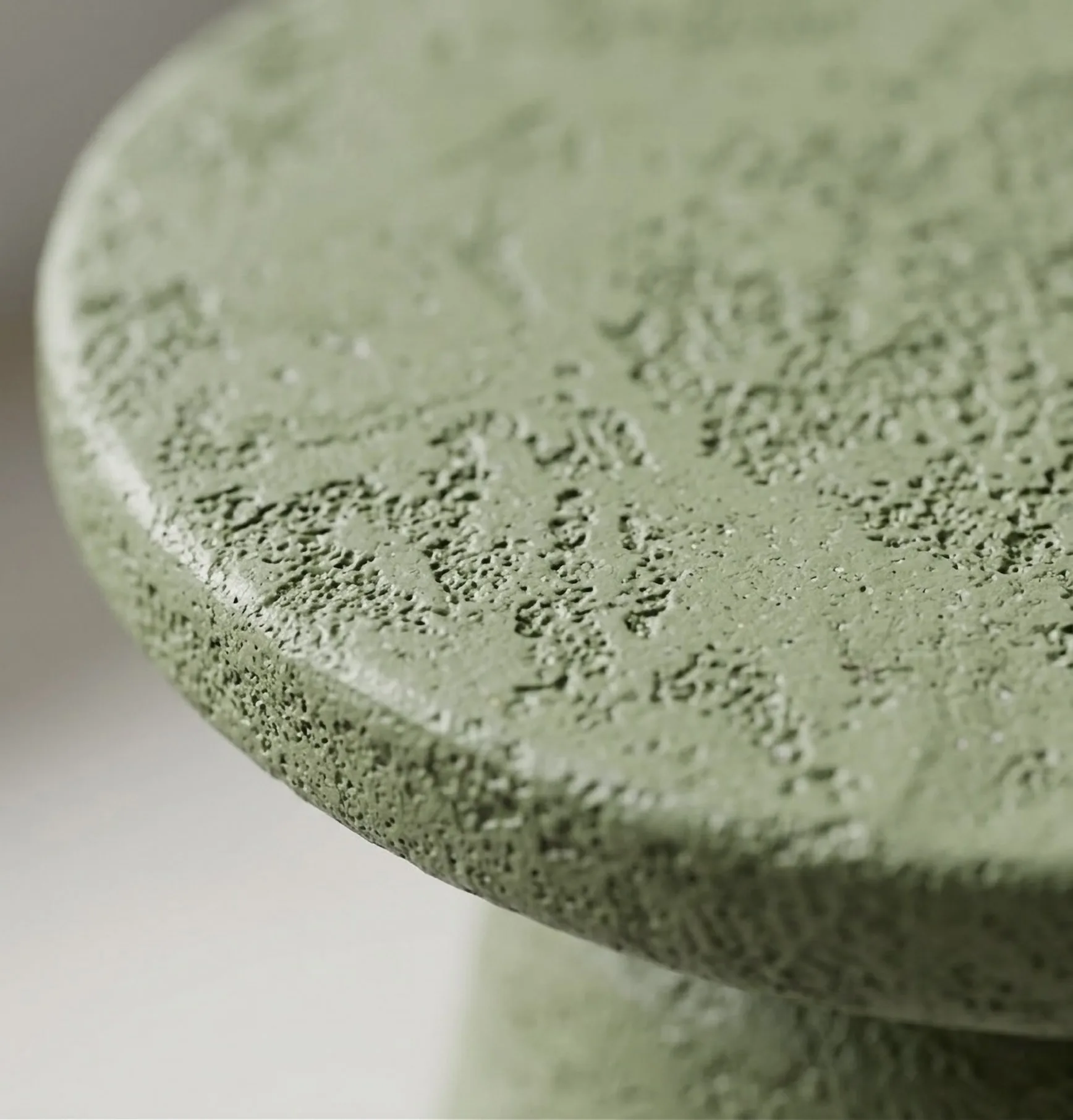 The hand-applied texture of the Olea surface, seen closely